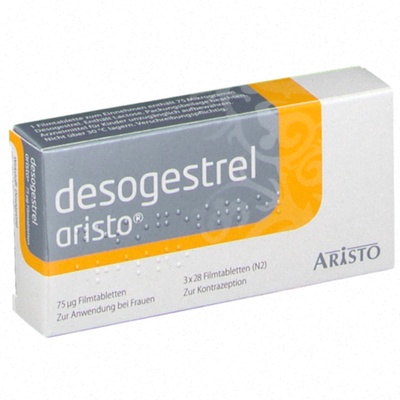 Comprimés de Desogestrel alignés sur un fond blanc